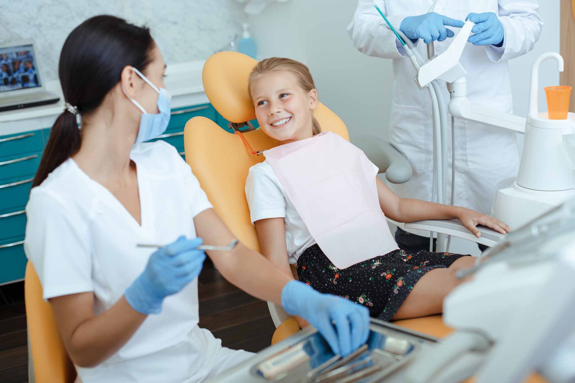 Child sitting on dentist chair at pediatric dentistry - Smart Pediatric Dentistry, Utah