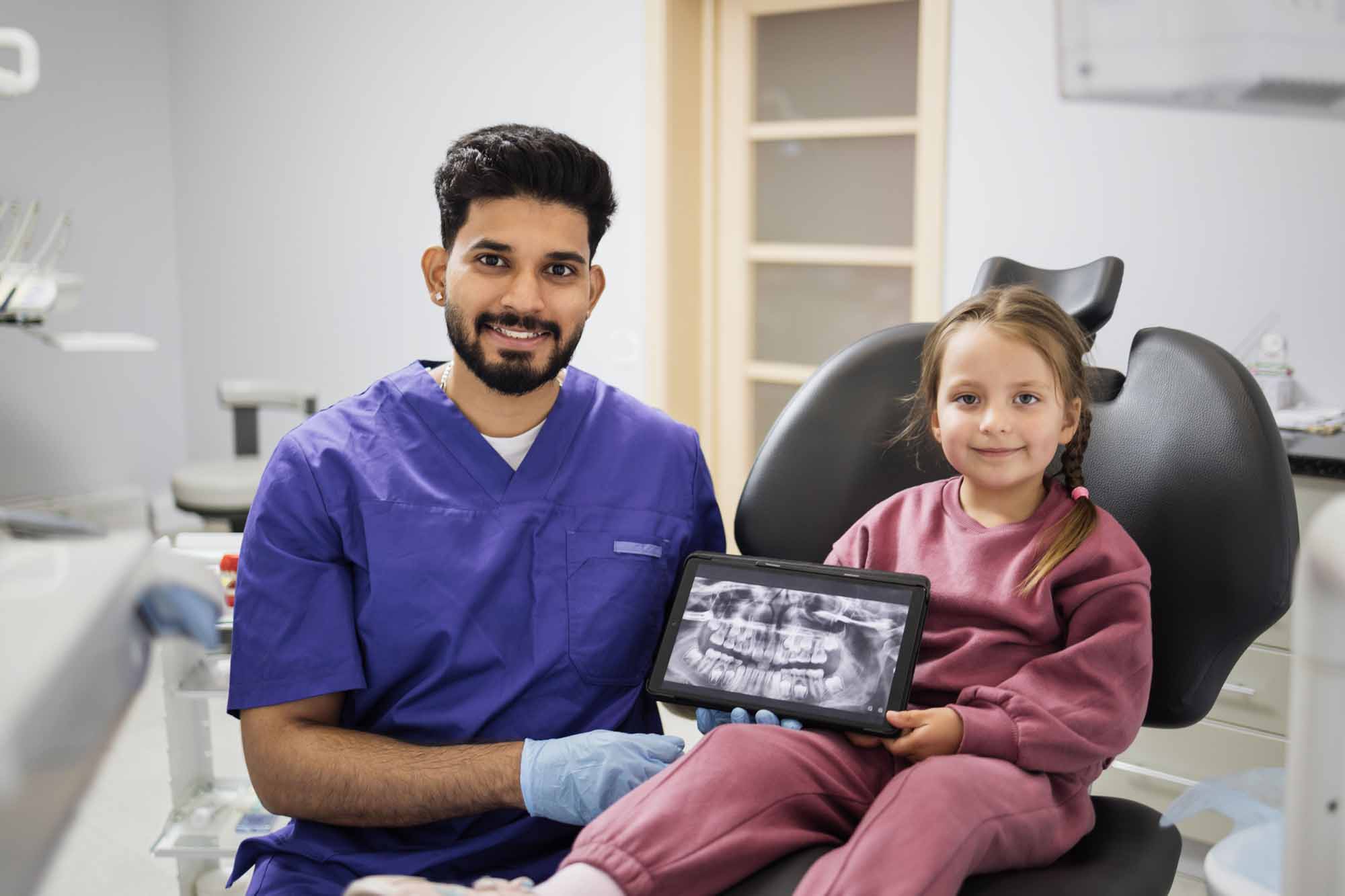 Girl holding dental x-ray - Smart Pediatric Dentistry, Utah
