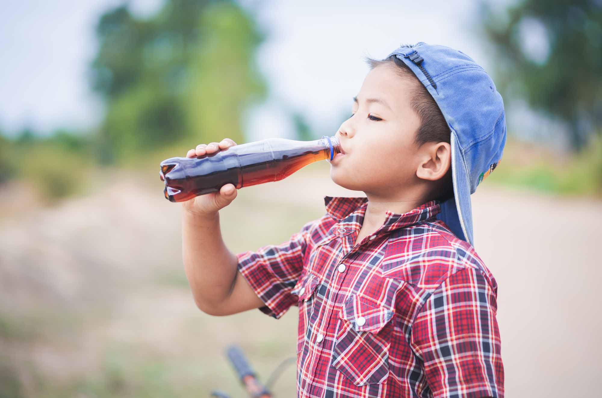 Little boy drinking a soft drink - Smart Pediatric Dentistry, Utah