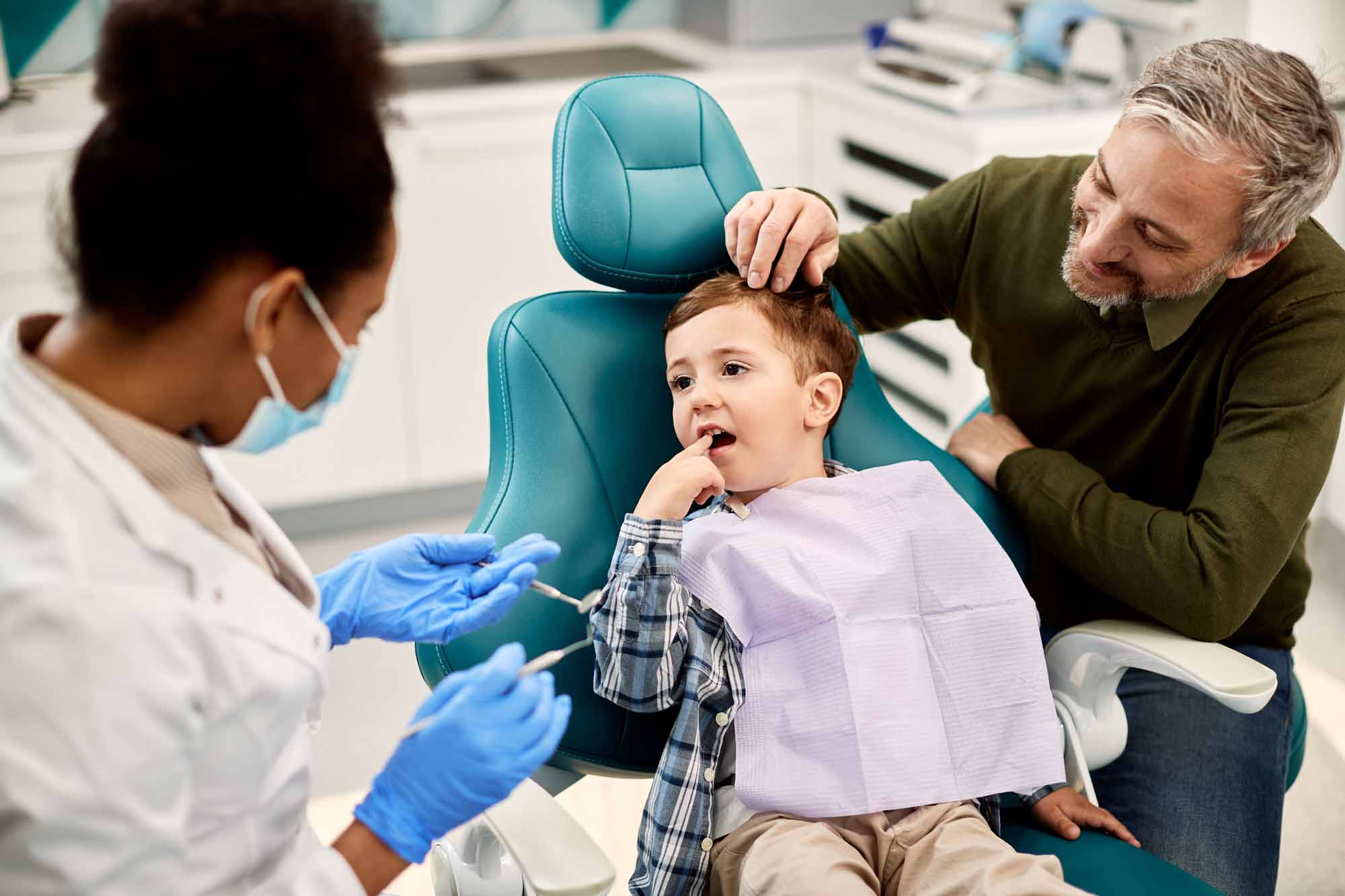 Young boy pointing at a tooth - Smart Pediatric Dentistry, Utah