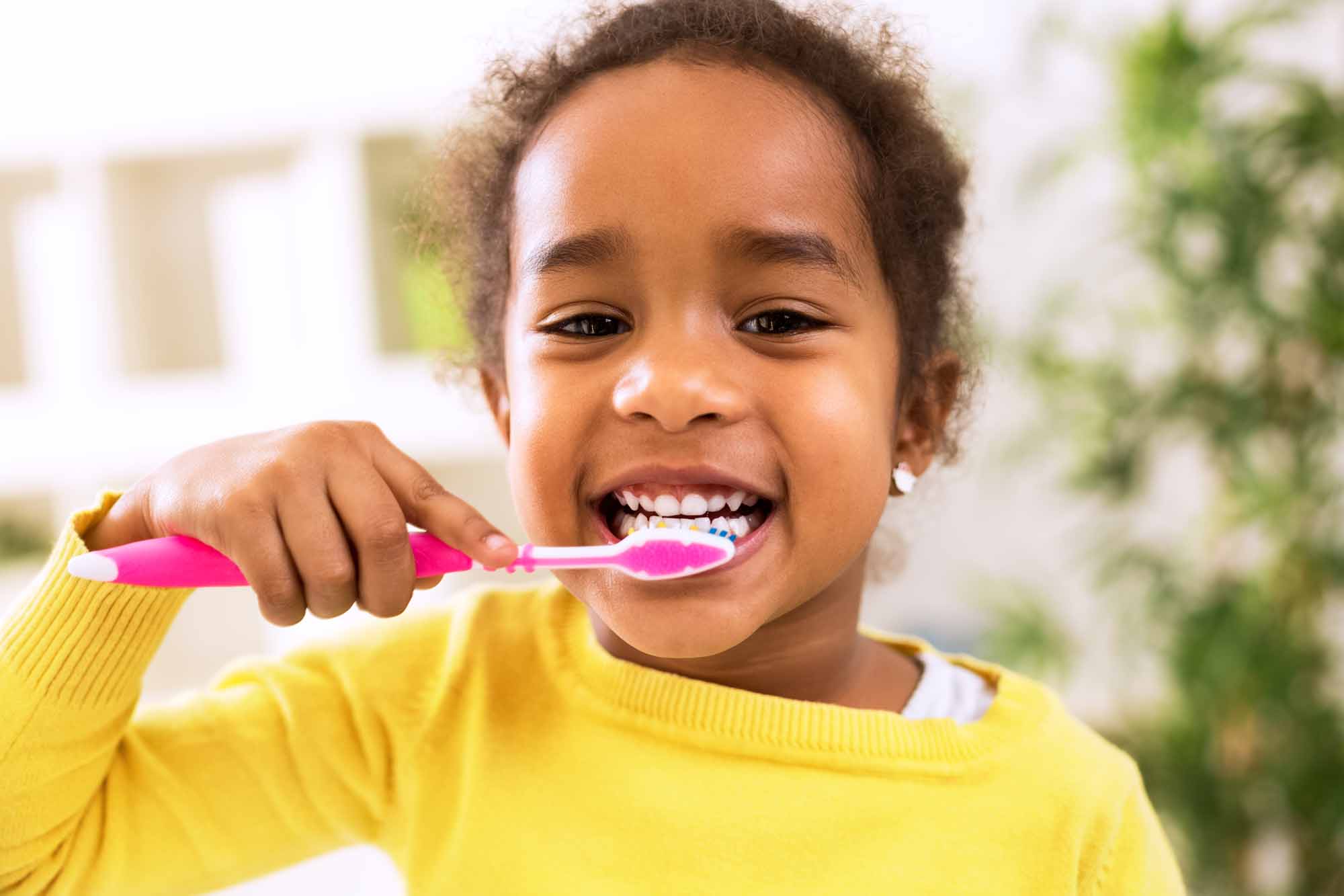young girl brushing her teeth - Smart Pediatric Dentistry, Utah