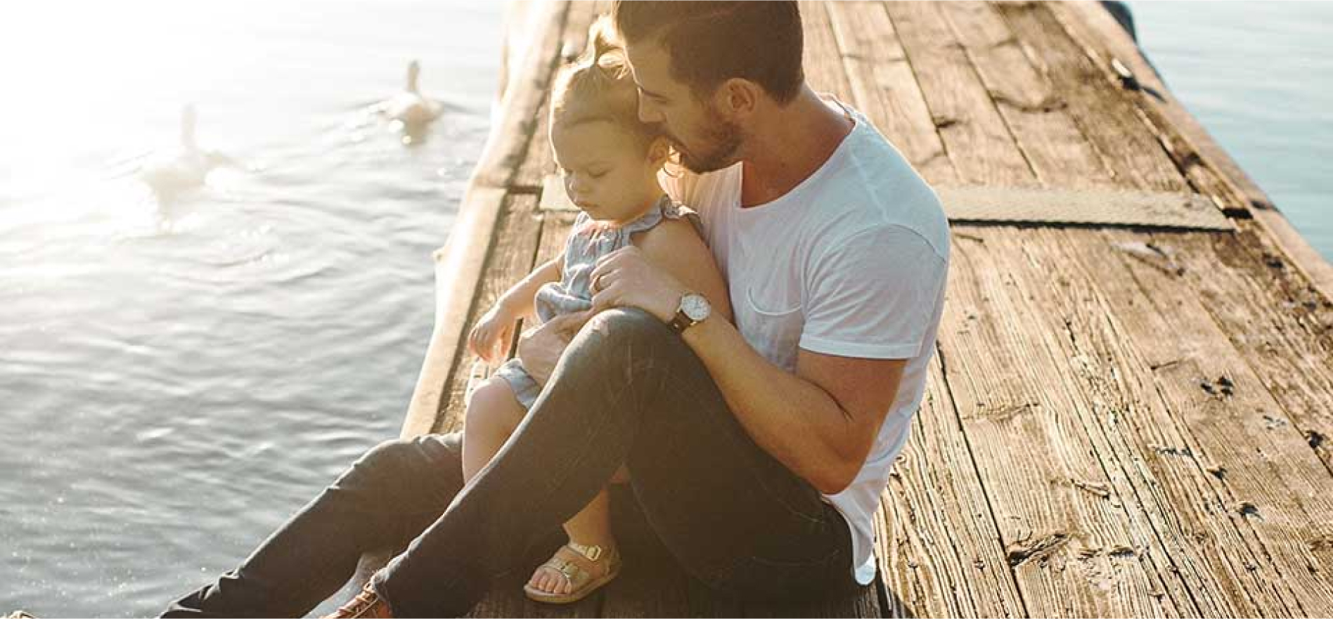 Man and child by the lake with healthy teeth - Smart Pediatric Dentistry, Utah